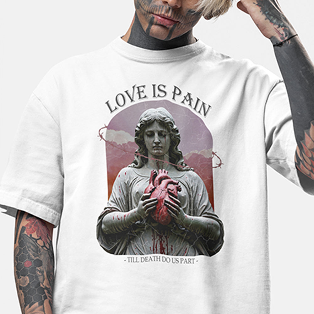 A close up image of the impius love is pain design on a white oversized tee