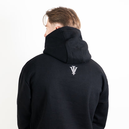 Tatooed model wearing black hoodie with death moth design showing the back logo
