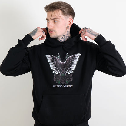 Tattooed model wearing a black hoodie with the impius death moth design