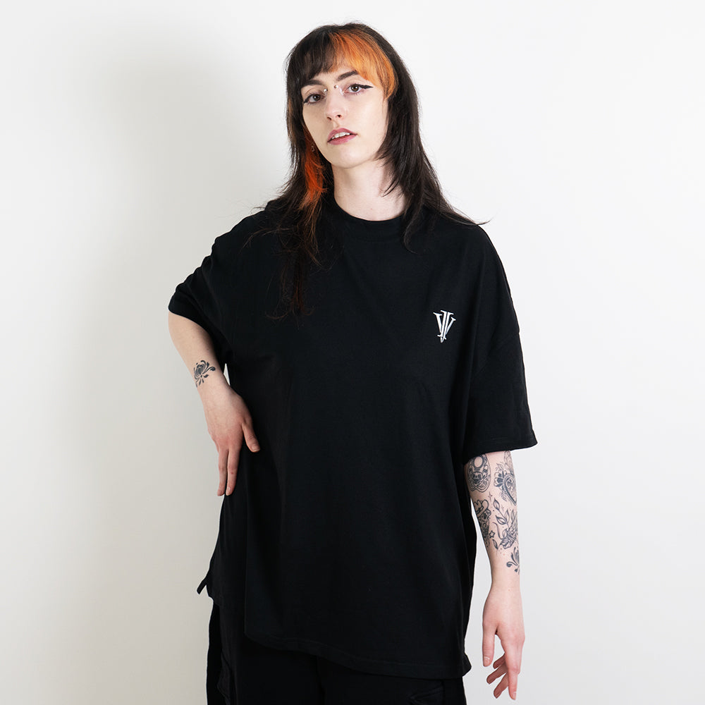 Alternative model wearing a black oversized tee with the impius logo
