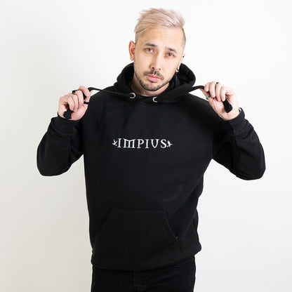 Alternative model wearing a black hoodie with the Impius logo