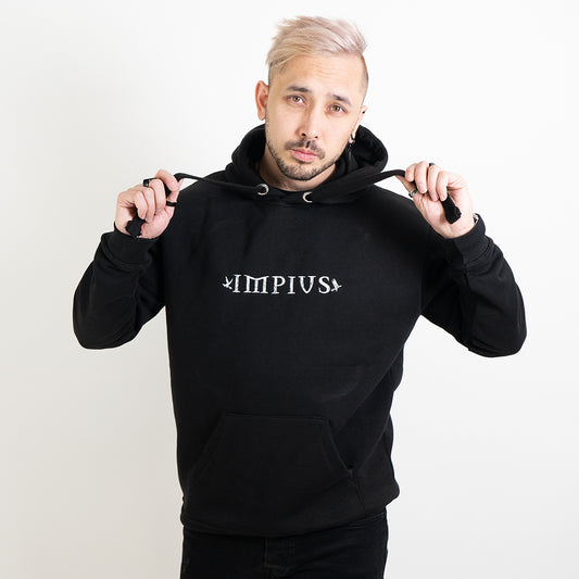 Alternative model wearing a black hoodie with the Impius logo