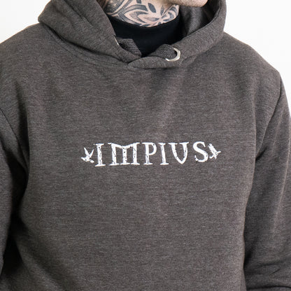 A close up image of the Impius logo on a grey hoodie