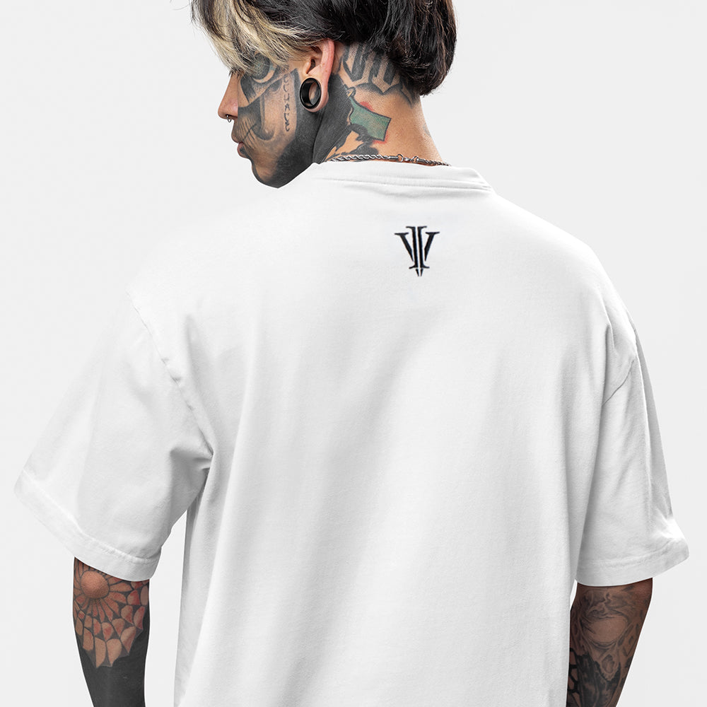 Tattooed model wearing a white oversized tee showing the back impius logo