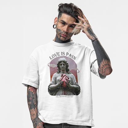 Tattooed model wearing a white oversized tee with the impius love is pain design
